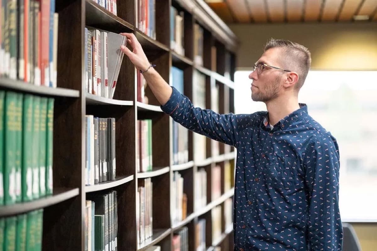 A student in the library stacks